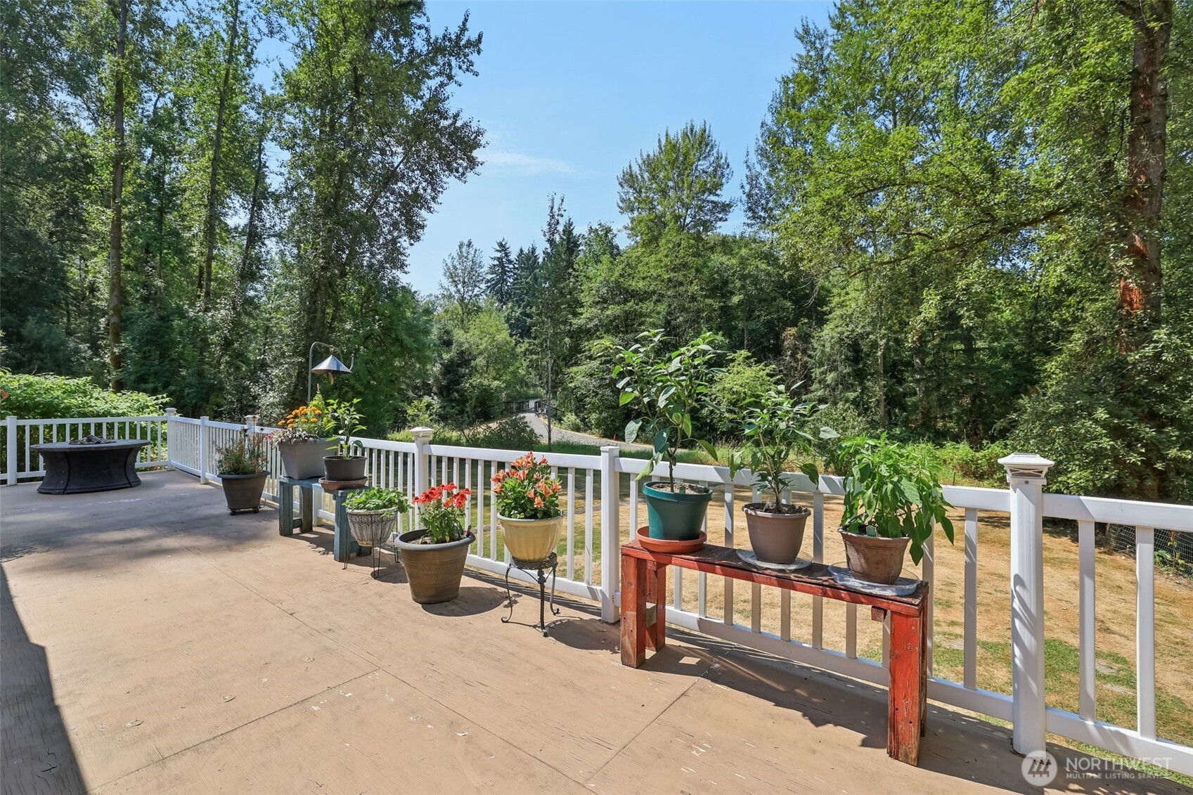 17209 West Riverside Drive Bothell, WA 98011 - Photo 38 of 39 a view of deck with furniture and trees