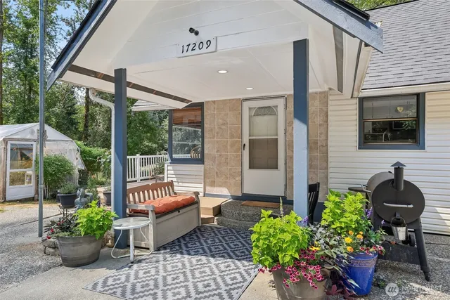 a lobby with chair and potted plant