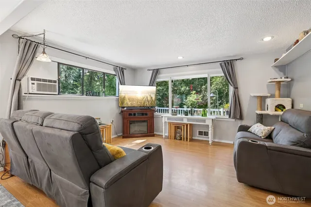 a living room with furniture and a large window