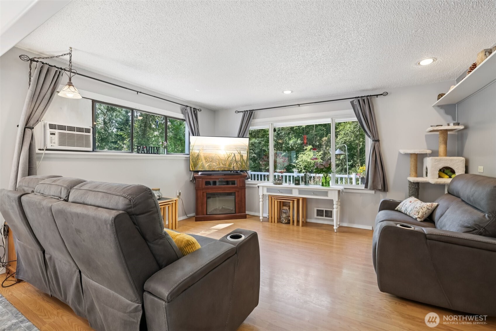 17209 West Riverside Drive Bothell, WA 98011 - Photo 5 of 39 a living room with furniture and a large window