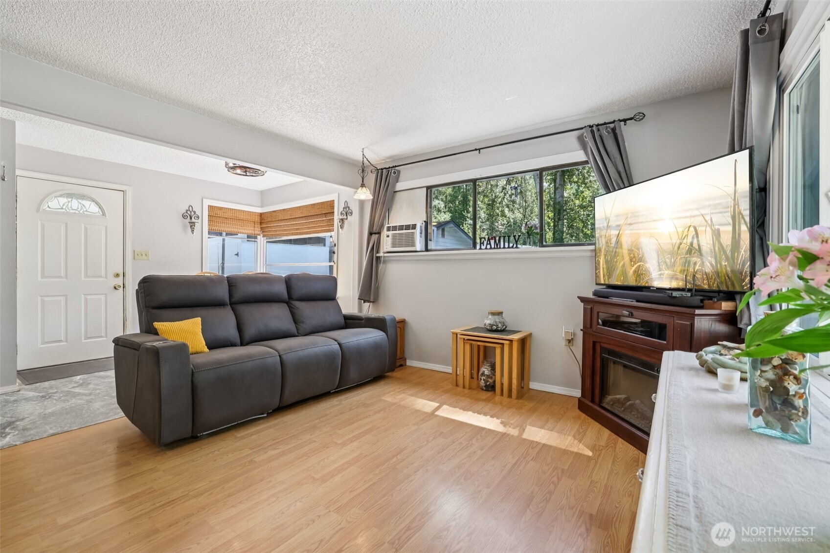 17209 West Riverside Drive Bothell, WA 98011 - Photo 6 of 39 a living room with furniture and a flat screen tv