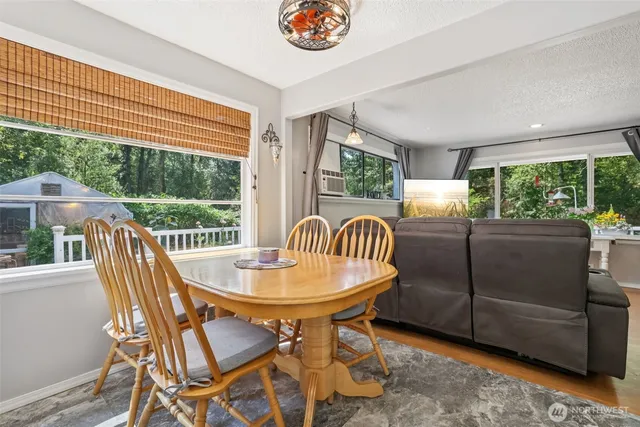 a view of a dining room with furniture window and outside view
