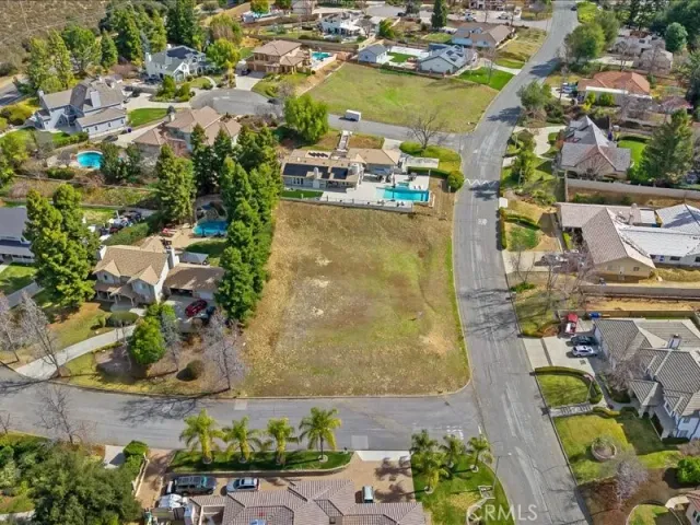 an aerial view of a house with a swimming pool