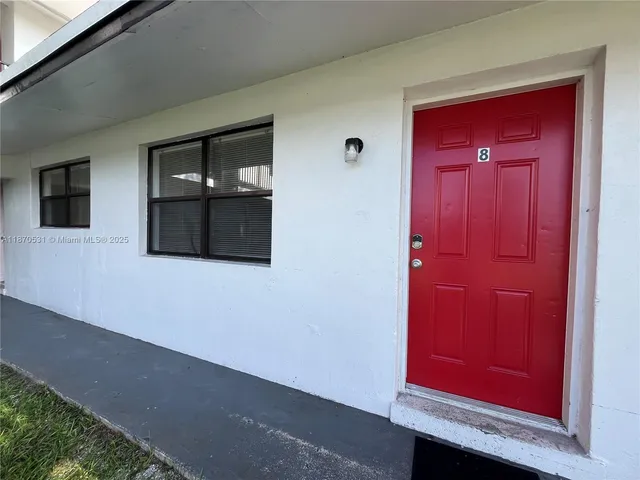 a view of a red door in the house