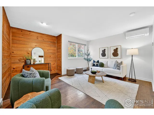 a living room with furniture and a lamp
