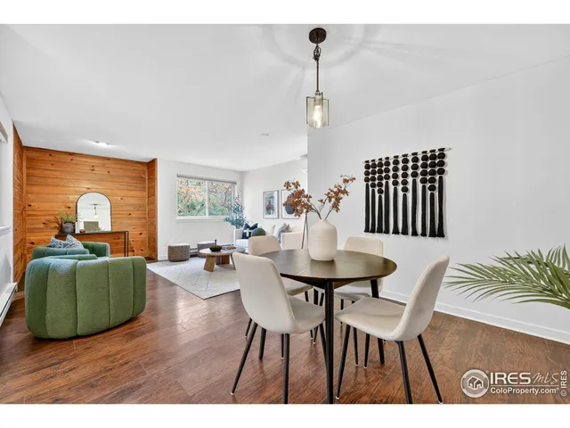 a view of a livingroom with furniture window and wooden floor