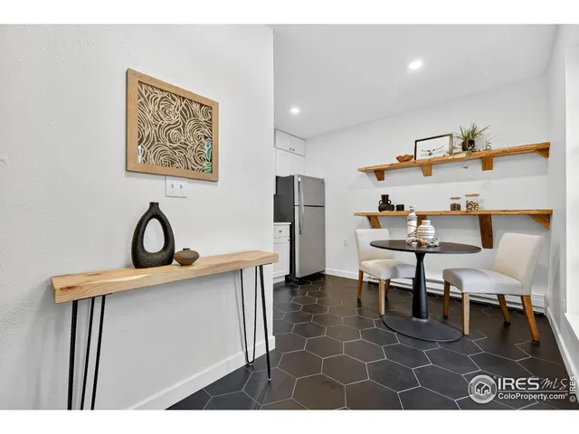 a view of dining room cabinets and wooden floor