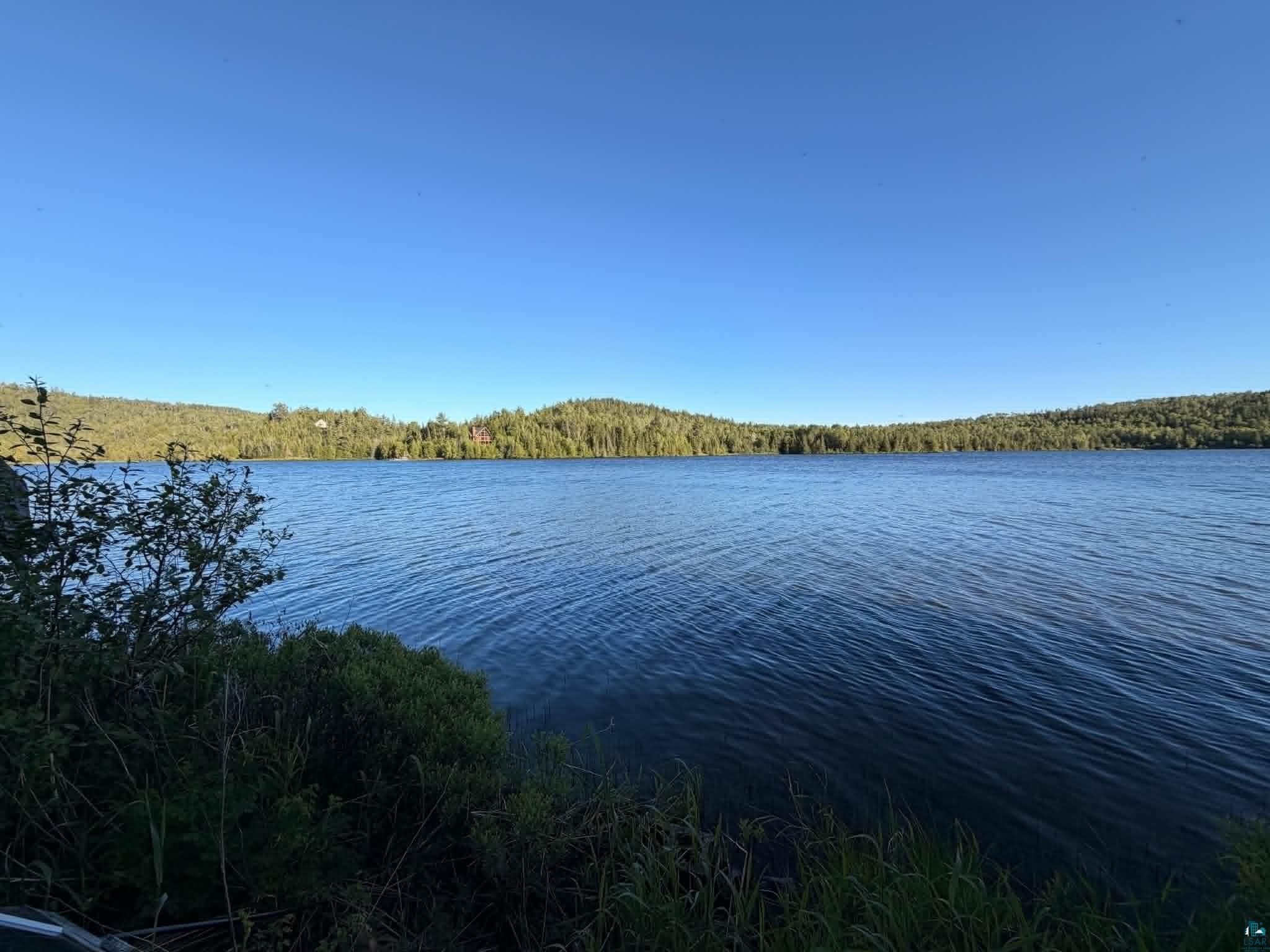 2 X Ary Point Road Hovland, MN 55606 - Photo 20 of 26 Expansive lakefront setting with clear blue waters and a distant treeline