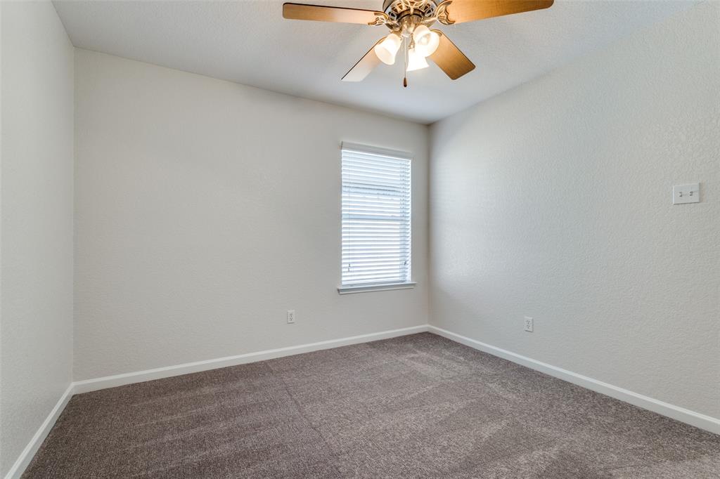 1257 Barrel Run Fort Worth, TX 76052 - Photo 20 of 29 an empty room with chandelier fan and window