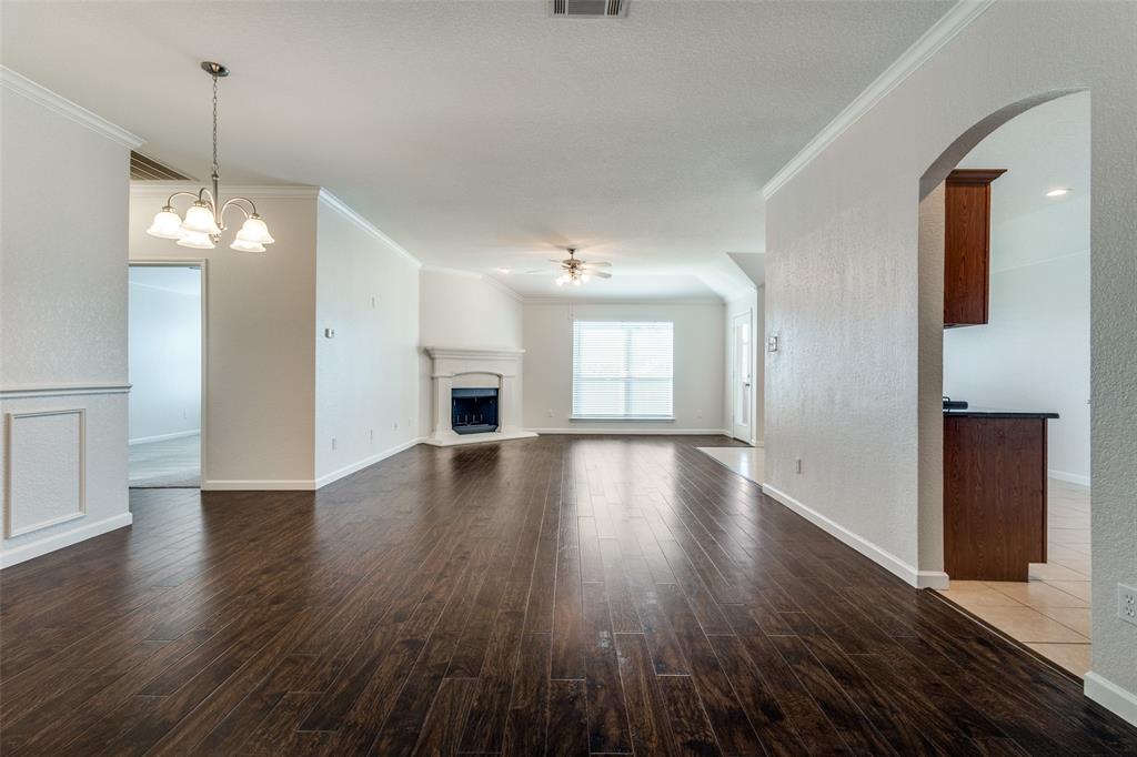 1257 Barrel Run Fort Worth, TX 76052 - Photo 5 of 29 a view of an empty room with wooden floor and a window