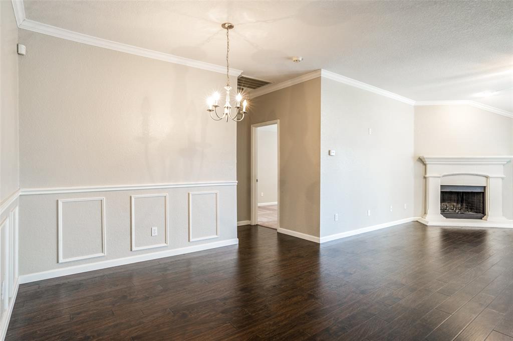 1257 Barrel Run Fort Worth, TX 76052 - Photo 6 of 29 a view of an empty room with wooden floor fireplace and a window