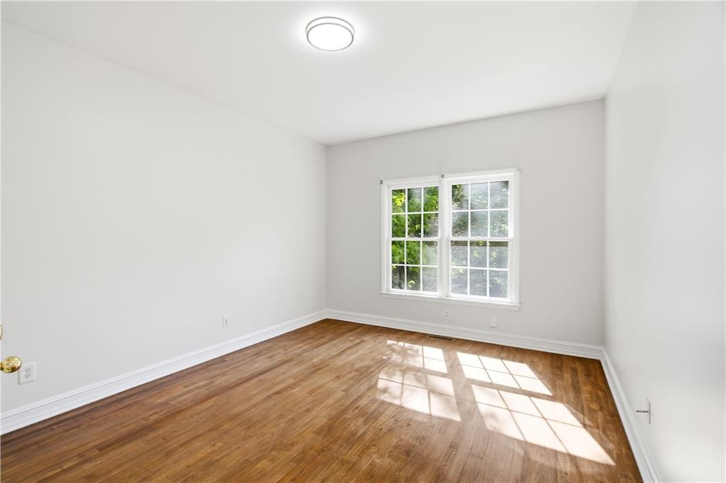 110 Mayes Farm Road Northwest Marietta, GA 30064 - Photo 29 of 49 an empty room with wooden floor and windows