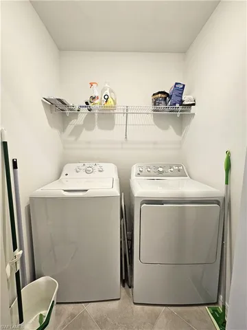 a view of a dining room with furniture and window