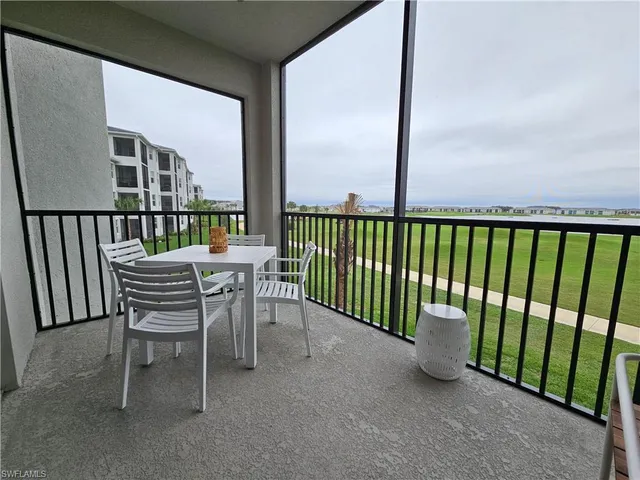 a view of a balcony with furniture