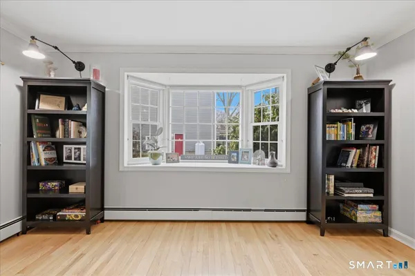 a spacious bedroom with a bed and a fireplace