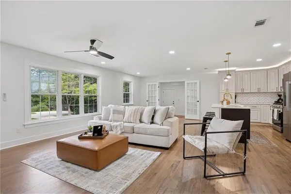 a living room with furniture and a large window