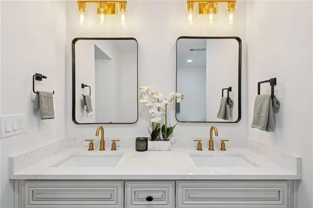 a bathroom with sink and mirror