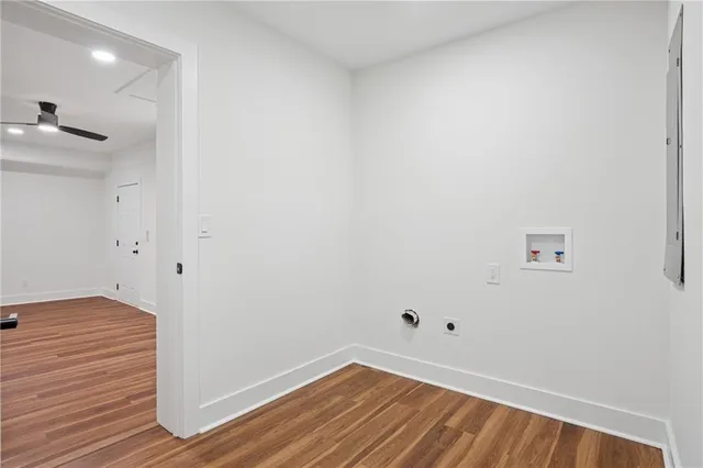 a view of hallway with wooden floor