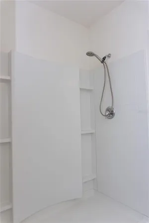 a view of an empty room and wooden floor