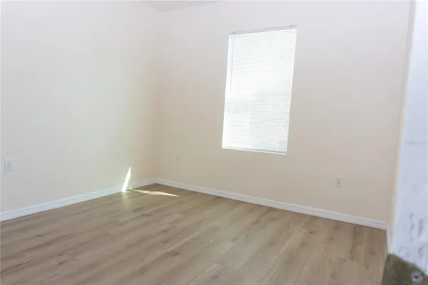 a bathroom with a granite countertop toilet a sink and bathtub