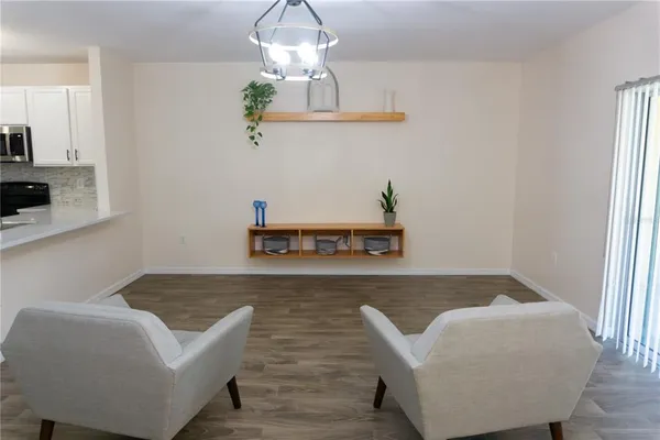 a living room with furniture and a table