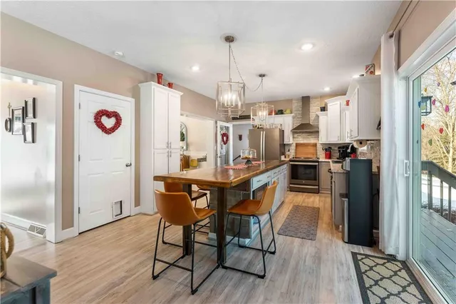 a view of a kitchen and dining area