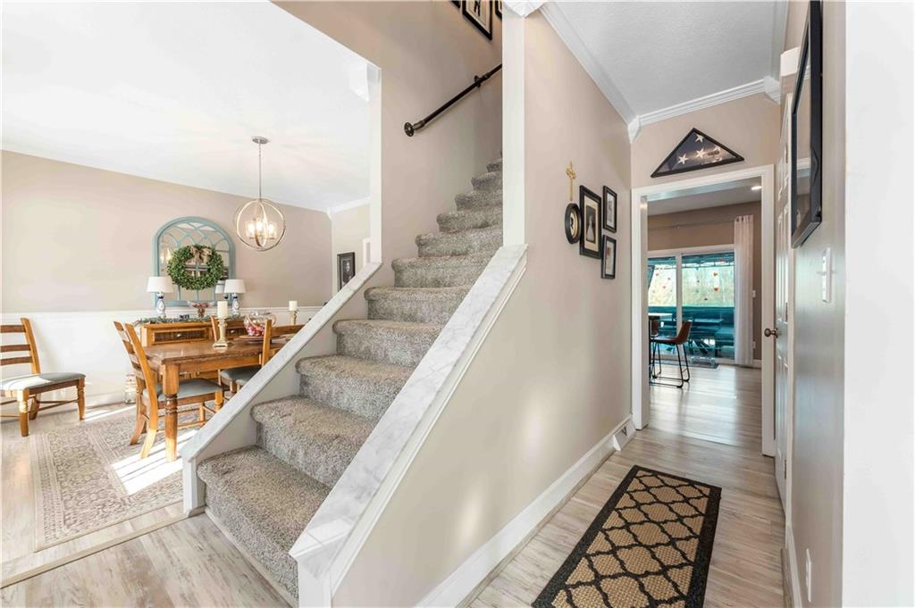 3400 Tuscarawas Road Beaver, PA 15009 - Photo 24 of 50 a view of a hallway to a livingroom with furniture and wooden floor