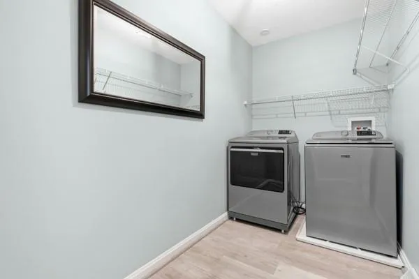 a bathroom with a sink toilet and a mirror