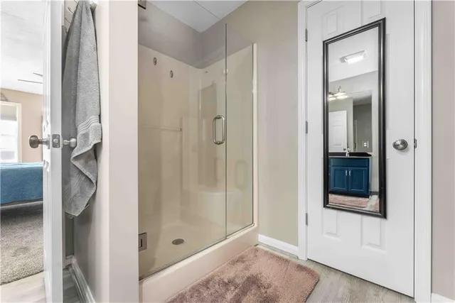 a bathroom with a shower and a sink