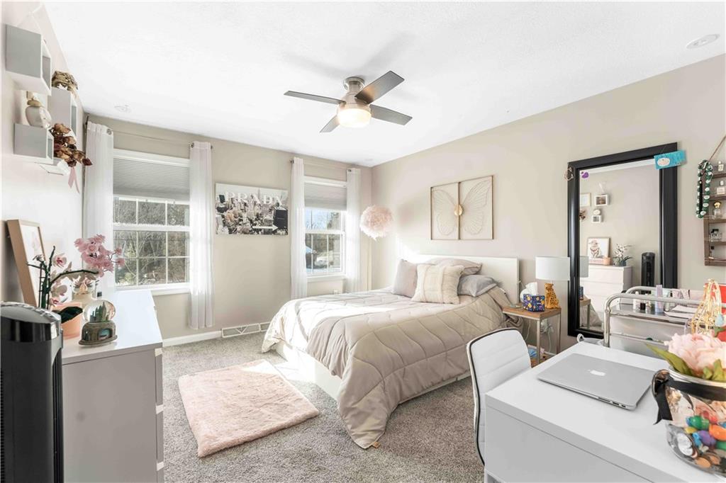 3400 Tuscarawas Road Beaver, PA 15009 - Photo 32 of 50 a bedroom with a bed and a chandelier