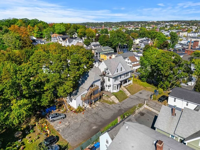 an aerial view of residential houses with outdoor space