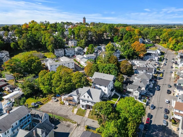 an aerial view of a house with outdoor space
