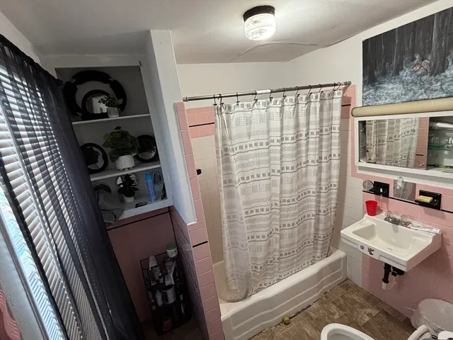 a bathroom with a sink and a shower