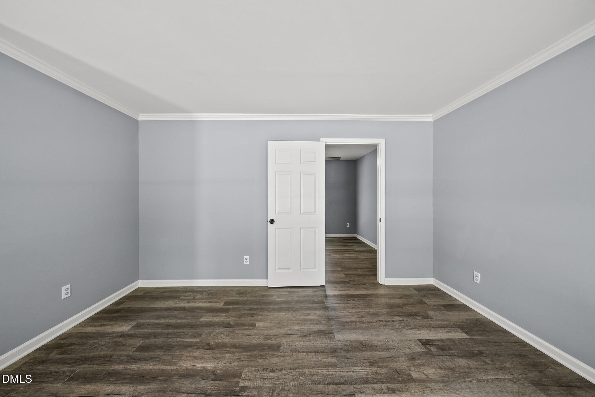2108 Treverton Place Raleigh, NC 27609 - Photo 11 of 30 a view of an empty room with wooden floor and closet