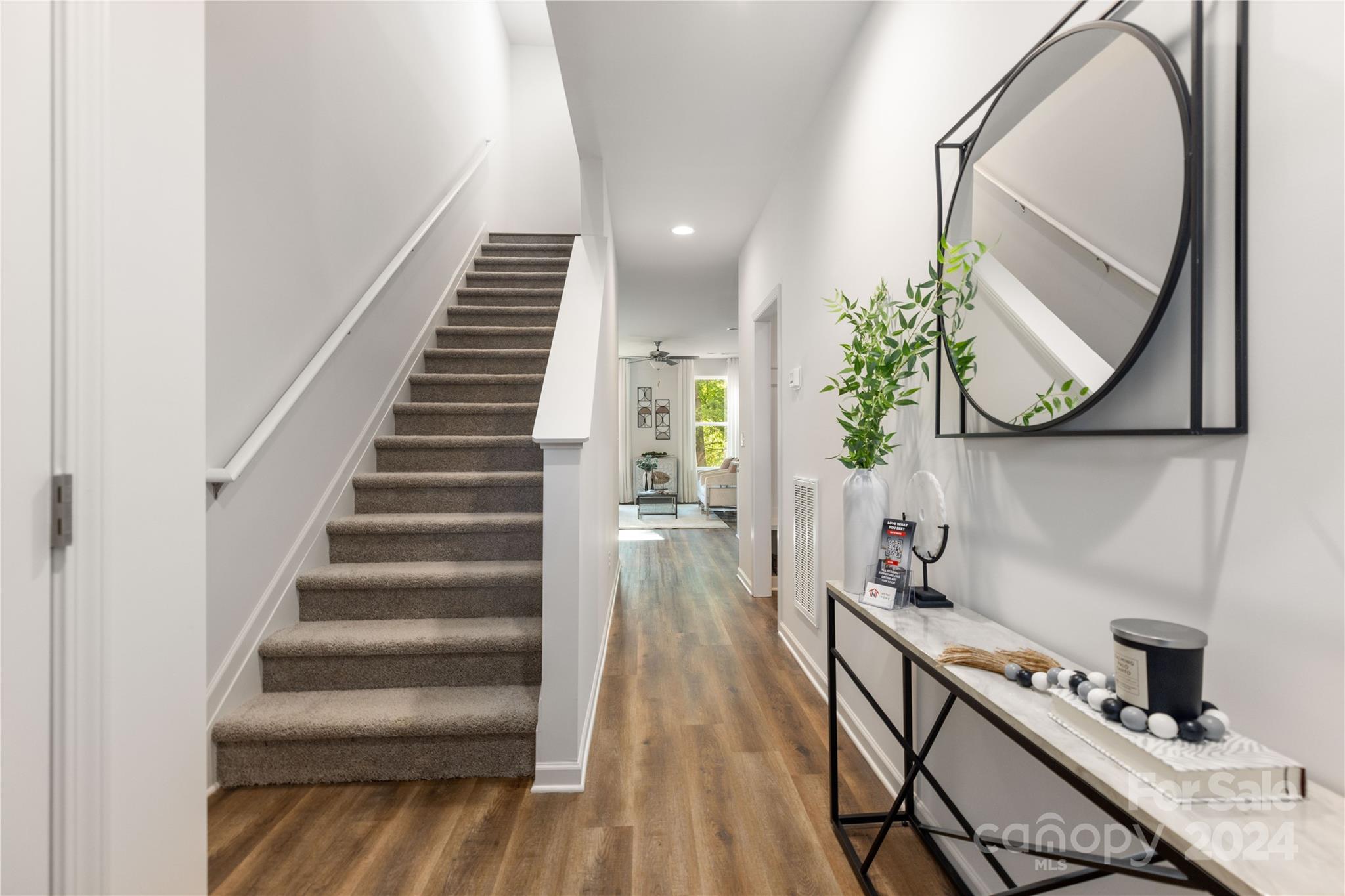 4329 Perkins Road Charlotte, NC 28269 - Photo 3 of 28 a view of a hallway with wooden floor and staircase