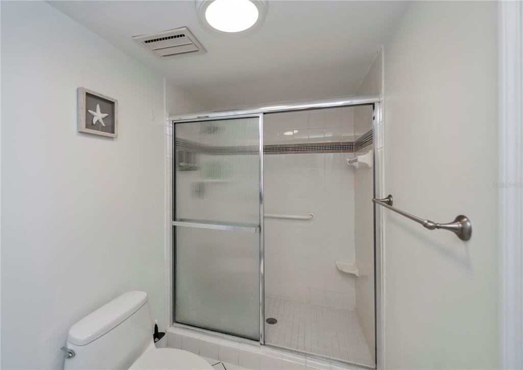 262 Cerromar Way South, Unit 53 Venice, FL 34293 - Photo 36 of 59 a bathroom with a shower