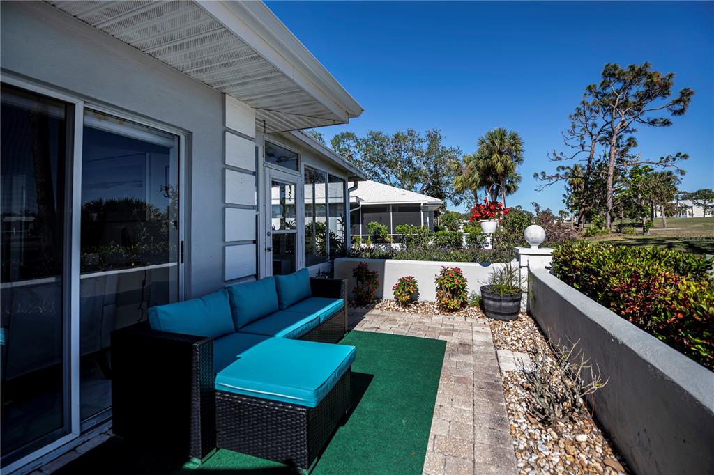 262 Cerromar Way South, Unit 53 Venice, FL 34293 - Photo 47 of 59 a view of a patio with couches table and chairs and potted plants