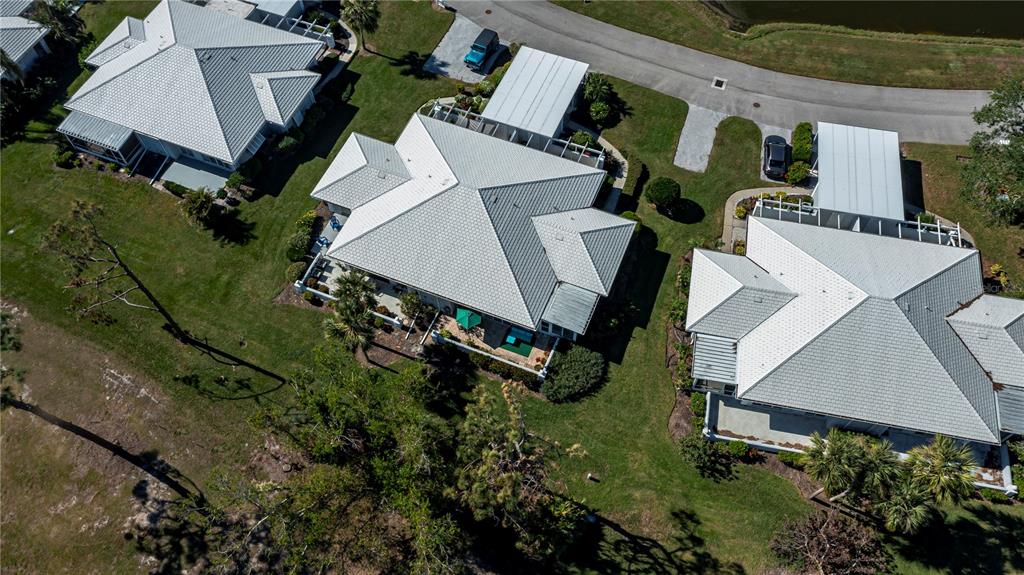262 Cerromar Way South, Unit 53 Venice, FL 34293 - Photo 53 of 59 an aerial view of a house with a yard