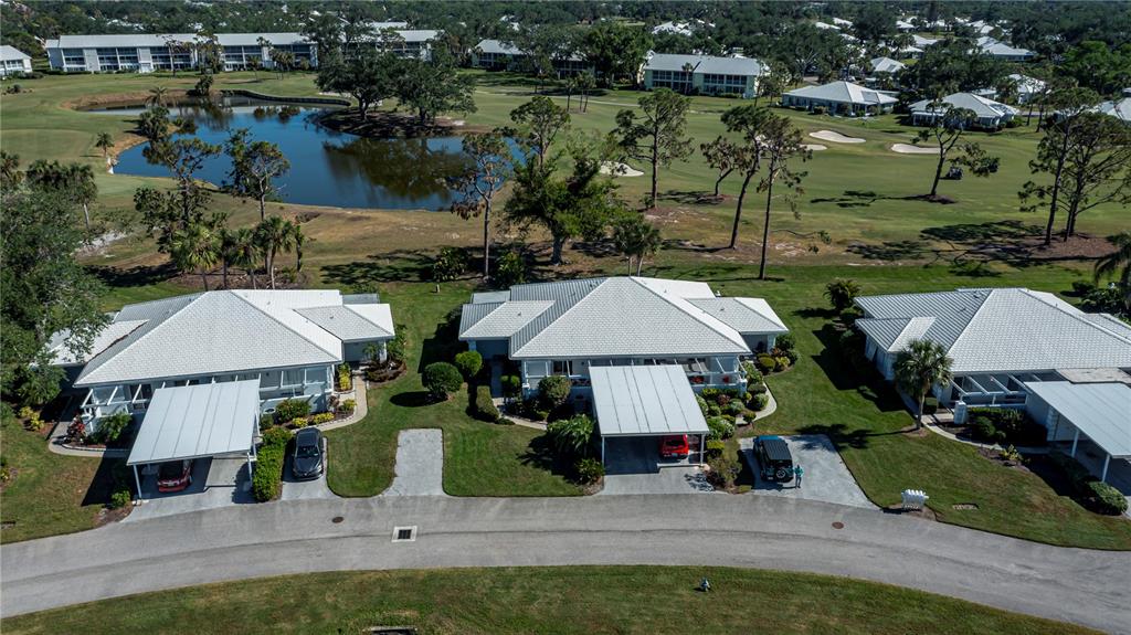 262 Cerromar Way South, Unit 53 Venice, FL 34293 - Photo 56 of 59 an aerial view of a house with swimming pool and outdoor seating