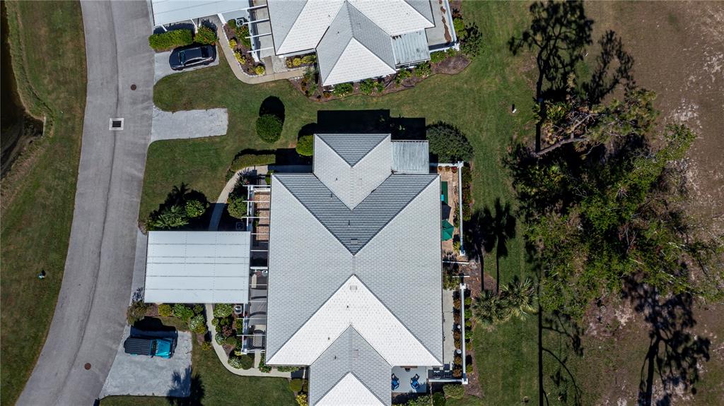 262 Cerromar Way South, Unit 53 Venice, FL 34293 - Photo 7 of 59 an aerial view of houses with yard