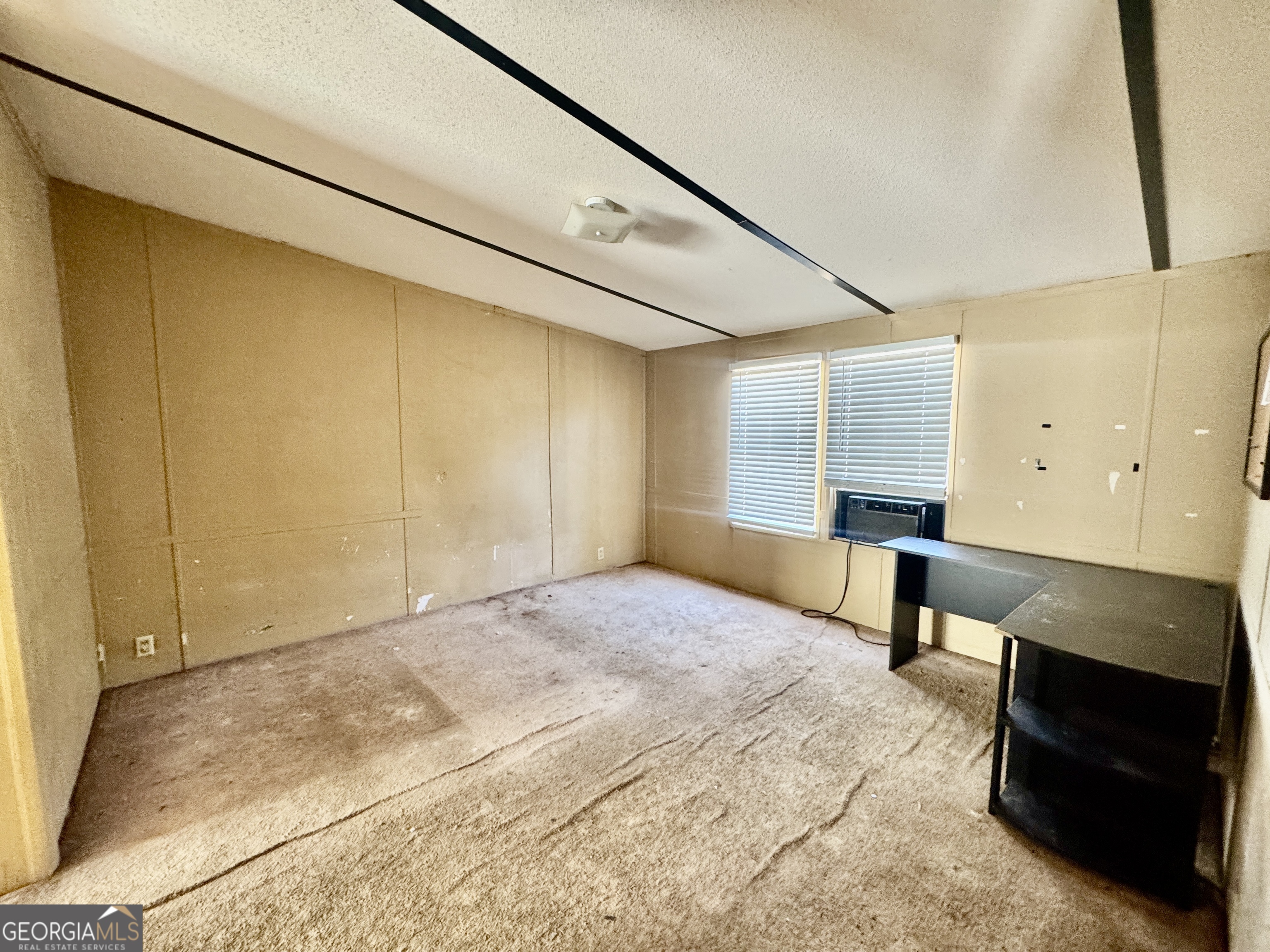 2211 New Cut Road Byromville, GA 31007 - Photo 13 of 25 a view of an empty room and a window