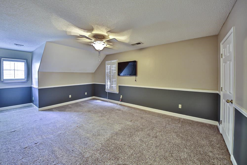 3693 Brunswick Road Bartlett, TN 38133 - Photo 25 of 30 Additional living space with a textured ceiling, carpet, and ceiling fan