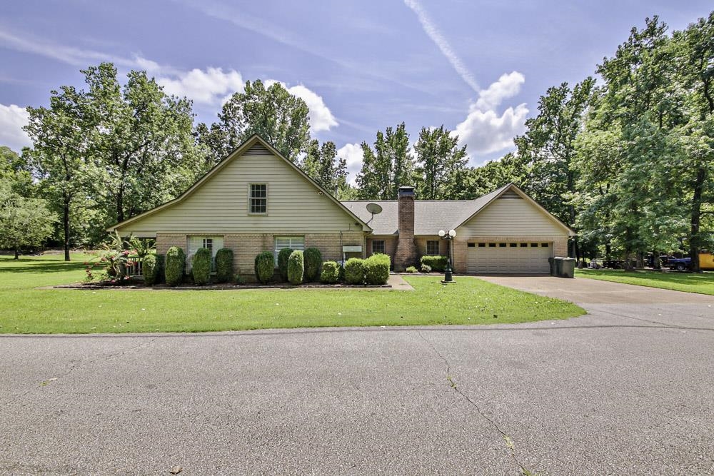 3693 Brunswick Road Bartlett, TN 38133 - Photo 6 of 30 View of front facade featuring a garage and a front yard