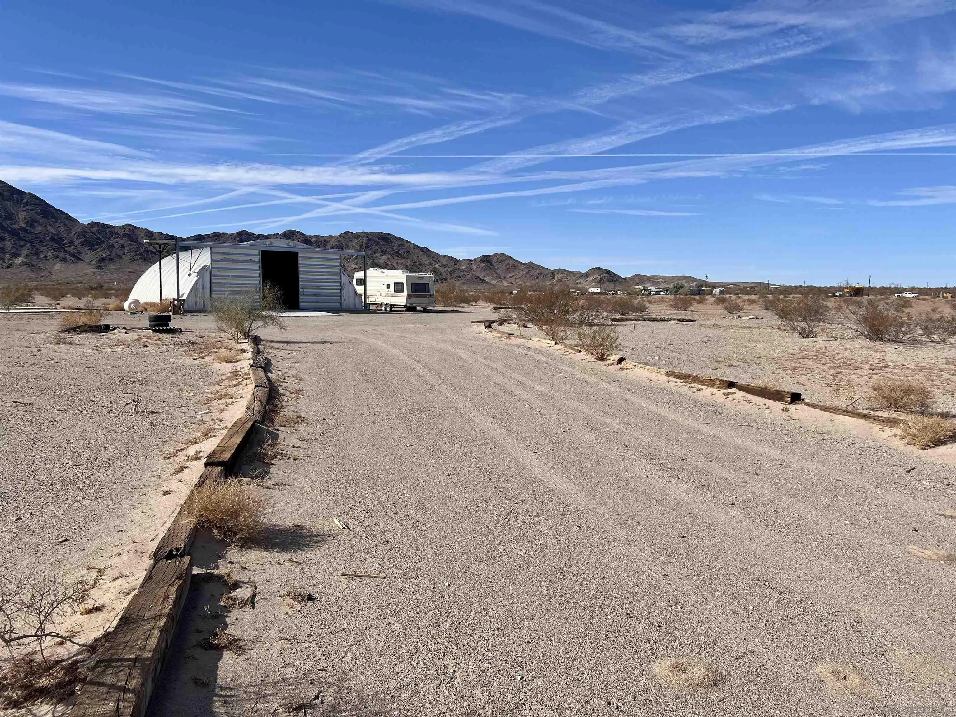 a view of a road with a ocean view