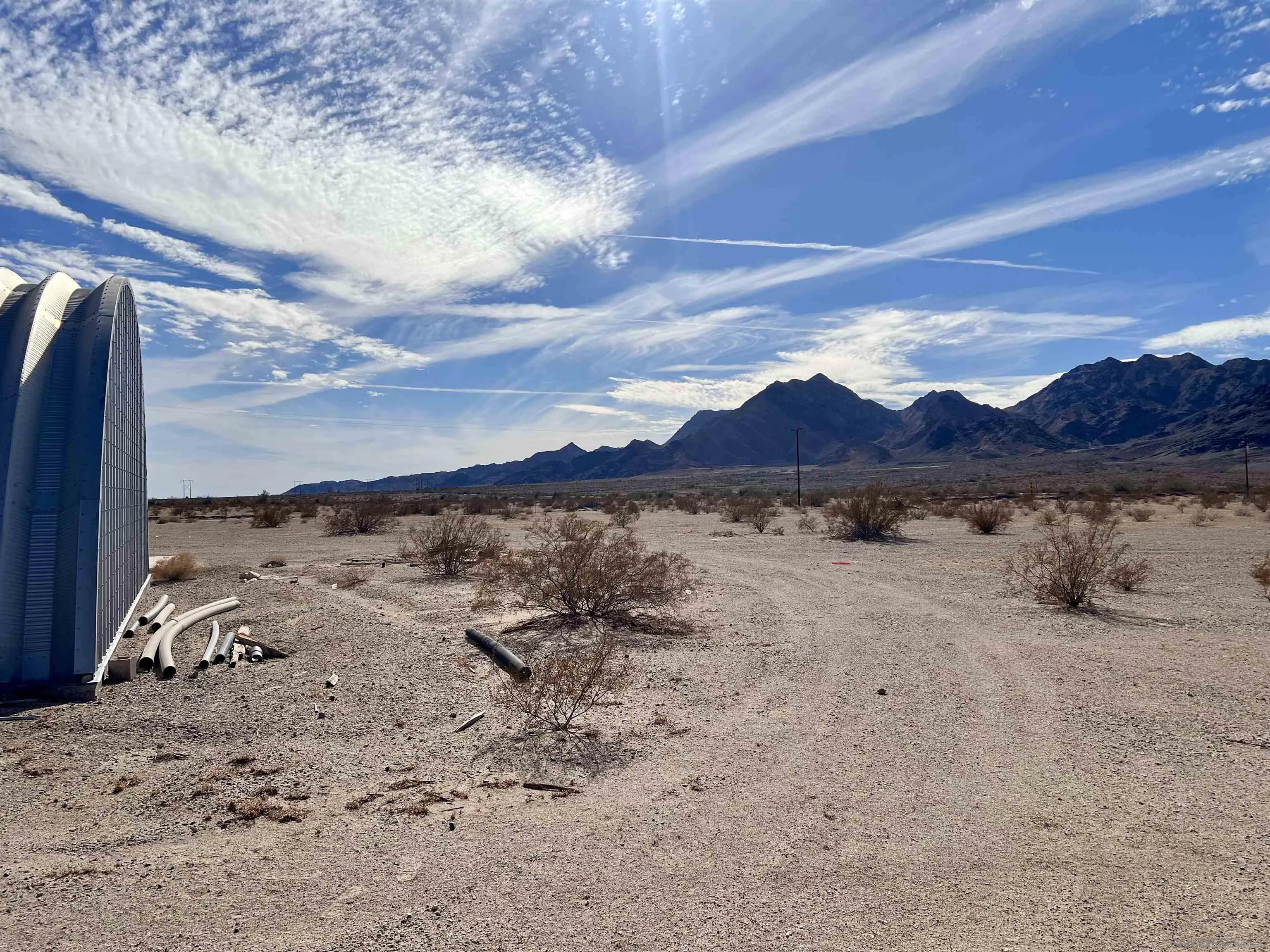 4260 Sutton Place Blythe, CA 92225 - Photo 16 of 35 a view of a dry yard with wooden fence