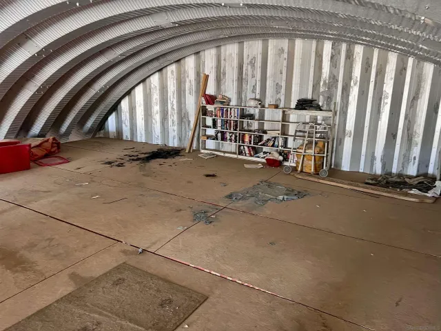 a view of an empty room with stairs