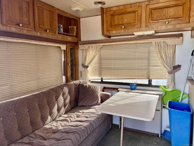 a view of a kitchen with furniture and a window