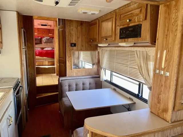 a view of a hallway with furniture and window