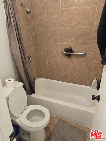 a bathroom with a sink a toilet and a bathtub
