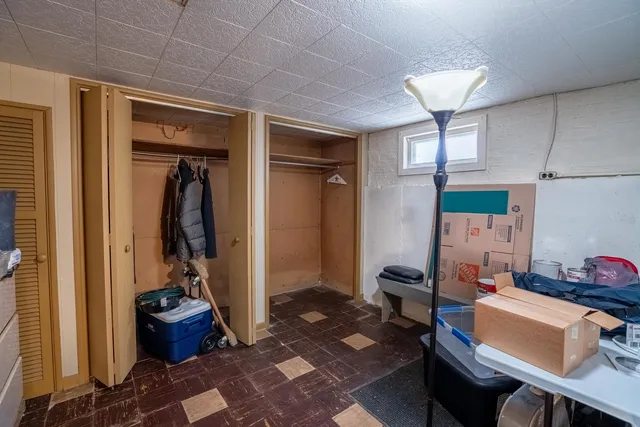 a room with furniture a rug and a window